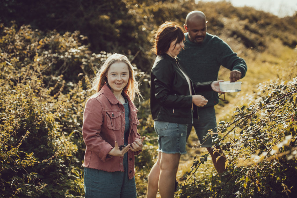 Image of blackberry picking on a family walk.