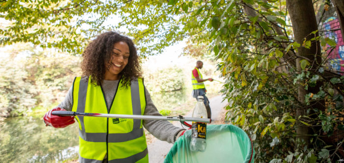 Photo of a woman litter picking.