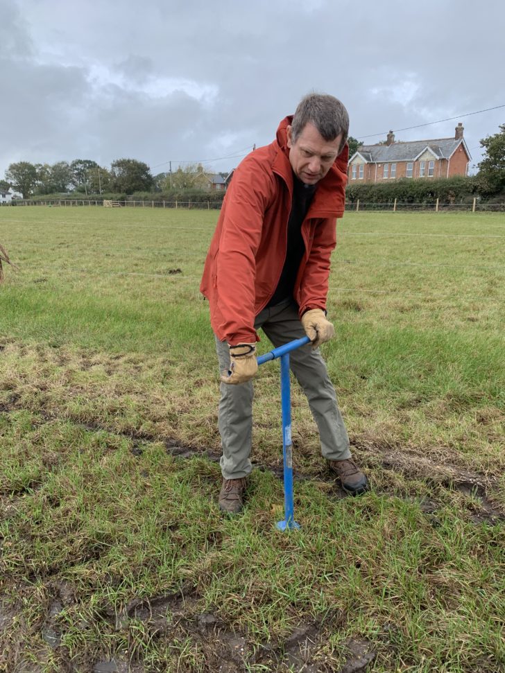 Image of volunteer taking soil samples