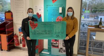 Photo of CPRE Hampshire receiving cheque from Waitrose Winchester